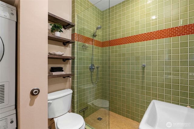 1111 E Pike St Unit 302, Seattle, WA 98122 - bathroom featuring estacked washer and dryer, a tile shower, and water heater