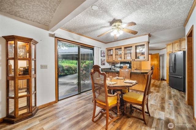 14000 NE 97th Ave, Vancouver, WA 98662 - dining room with a textured ceiling, light wood-style floors, ceiling fan, and ornamental molding