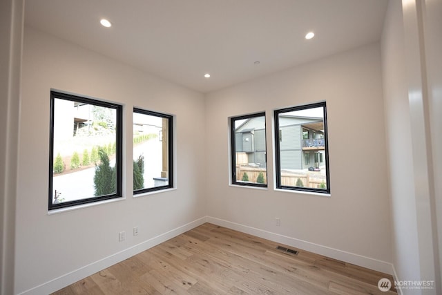 24018 Dolphin Ln, Mount Vernon, WA 98274 - empty room with plenty of natural light, recessed lighting, and light wood-type flooring