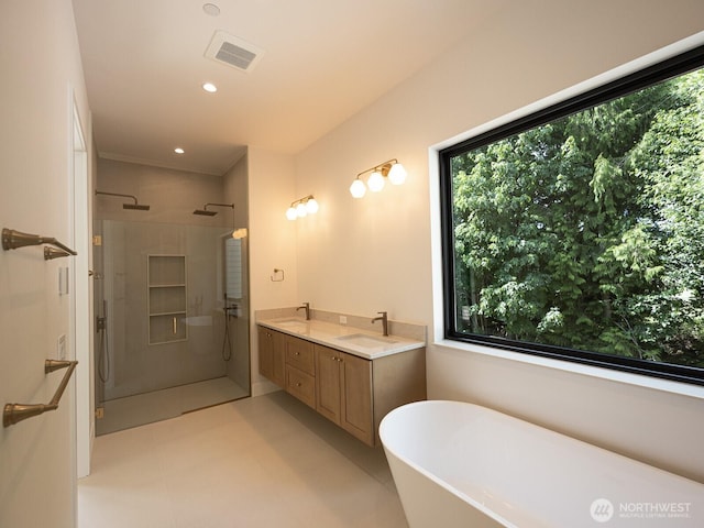 24018 Dolphin Ln, Mount Vernon, WA 98274 - bathroom with a walk in shower, a freestanding tub, plenty of natural light, double vanity, and recessed lighting