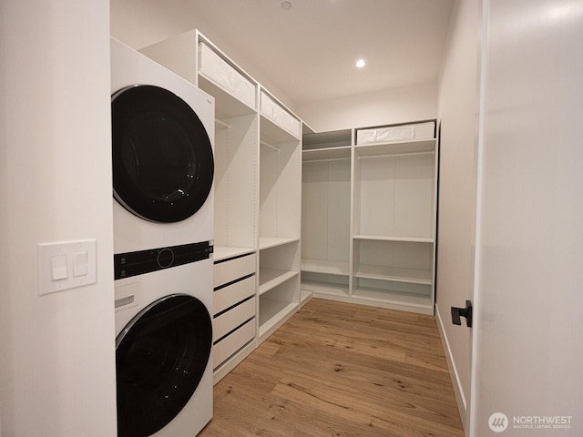 24018 Dolphin Ln, Mount Vernon, WA 98274 - washroom with stacked washer / dryer, light wood finished floors, and recessed lighting