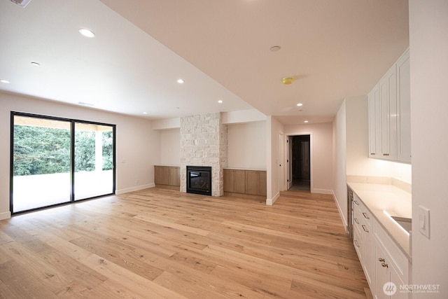 24018 Dolphin Ln, Mount Vernon, WA 98274 - unfurnished living room featuring light wood-style floors, recessed lighting, and a fireplace
