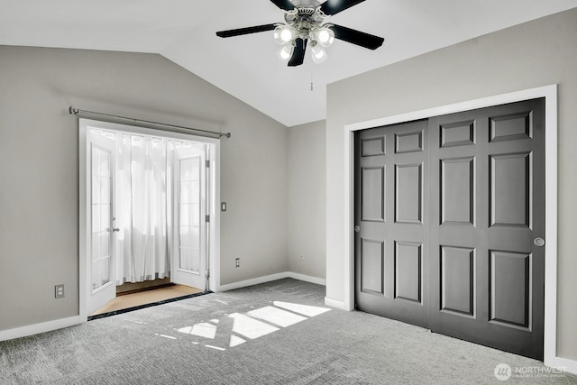 4138 21st Ave SW, Seattle, WA 98106 - unfurnished bedroom with lofted ceiling, carpet, and ceiling fan