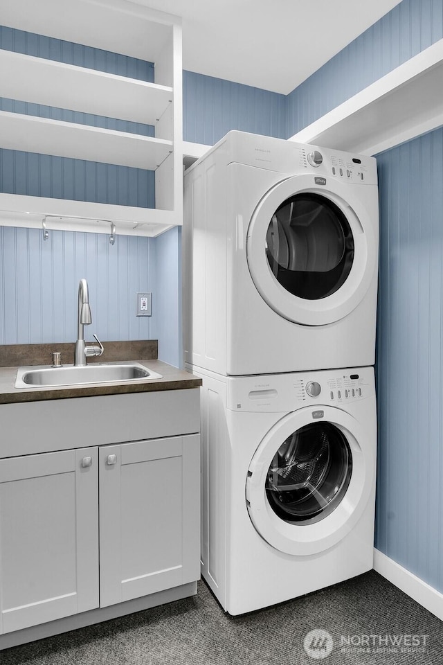 4138 21st Ave SW, Seattle, WA 98106 - laundry area with stacked washer / drying machine and cabinet space