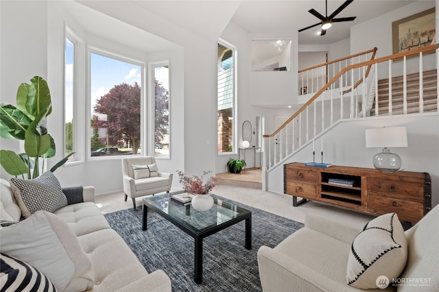 19724 Island Pkwy E, Lake Tapps, WA 98391 - carpeted living area featuring stairs and a ceiling fan