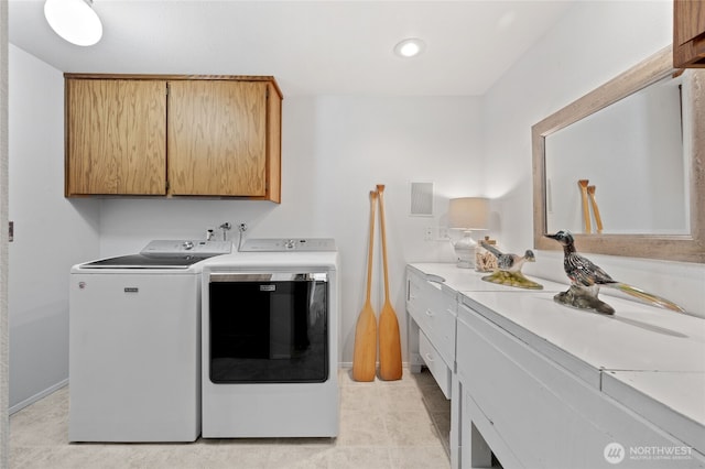 19724 Island Pkwy E, Lake Tapps, WA 98391 - laundry area featuring cabinet space, washer and dryer, light tile patterned flooring, and recessed lighting
