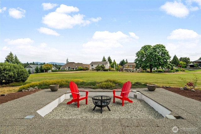 19724 Island Pkwy E, Lake Tapps, WA 98391 - view of patio / terrace with an outdoor fire pit and a residential view