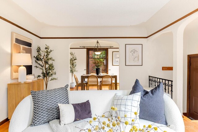 1214 NE 98th St, Seattle, WA 98115 - living room featuring arched walkways and wood finished floors