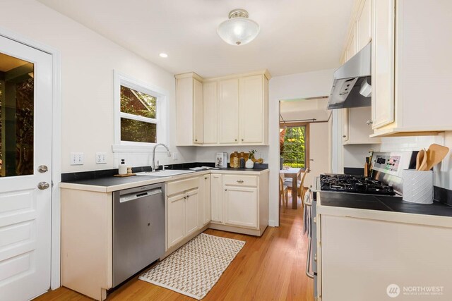 1214 NE 98th St, Seattle, WA 98115 - kitchen with dishwasher, under cabinet range hood, light wood-style floors, gas stove, and recessed lighting