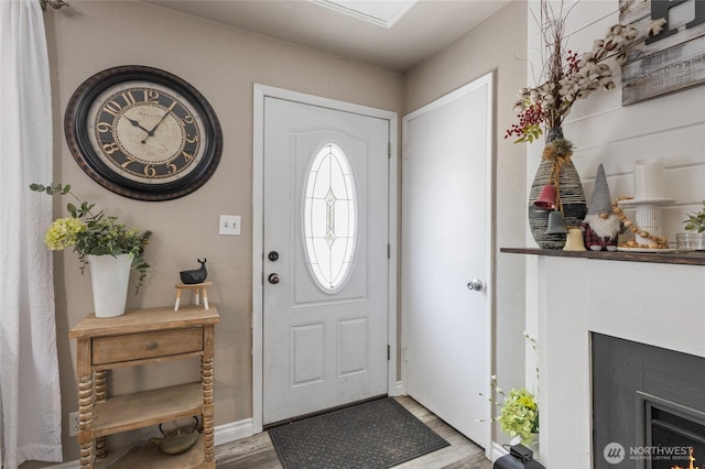 863 N Vista Dr, Moses Lake, WA 98837 - foyer entrance with wood finished floors and a fireplace