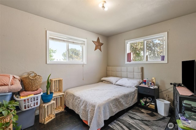 863 N Vista Dr, Moses Lake, WA 98837 - bedroom featuring multiple windows and dark wood-type flooring
