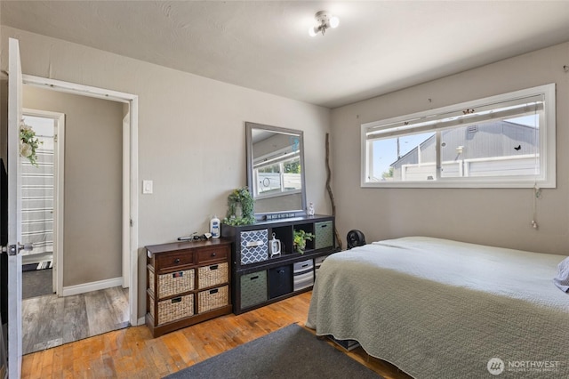 863 N Vista Dr, Moses Lake, WA 98837 - bedroom featuring wood finished floors and baseboards