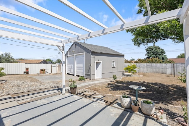 863 N Vista Dr, Moses Lake, WA 98837 - fenced backyard featuring a detached garage, a patio area, a pergola, and a storage shed