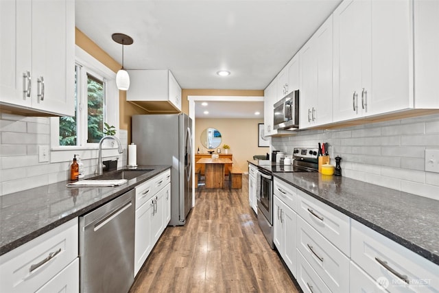 17627 17th Dr SE, Bothell, WA 98012 - kitchen featuring stainless steel appliances, white cabinetry, tasteful backsplash, and recessed lighting