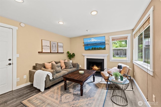 17627 17th Dr SE, Bothell, WA 98012 - living room with wood finished floors, a warm lit fireplace, and recessed lighting