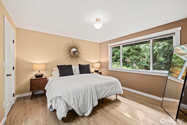 17627 17th Dr SE, Bothell, WA 98012 - bedroom with baseboards and light wood finished floors