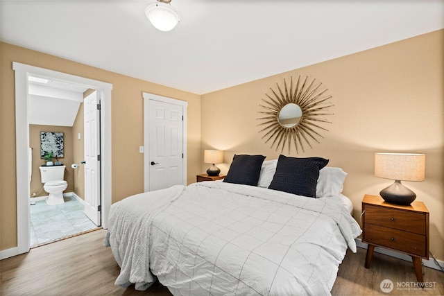 17627 17th Dr SE, Bothell, WA 98012 - bedroom featuring wood finished floors and connected bathroom