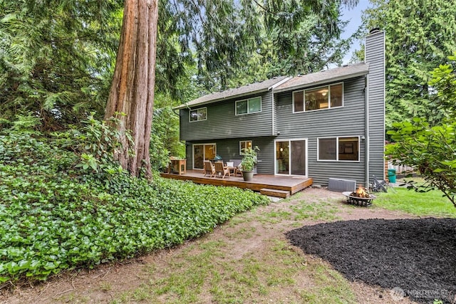17627 17th Dr SE, Bothell, WA 98012 - back of property with a fire pit, a deck, and a chimney