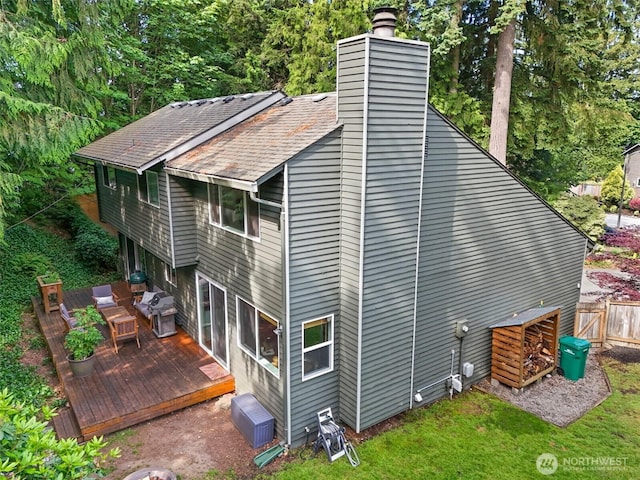 17627 17th Dr SE, Bothell, WA 98012 - back of house featuring a wooden deck, a chimney, and a shingled roof