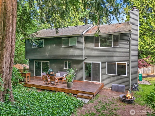17627 17th Dr SE, Bothell, WA 98012 - back of property featuring a chimney, a wooden deck, and an outdoor living space with a fire pit