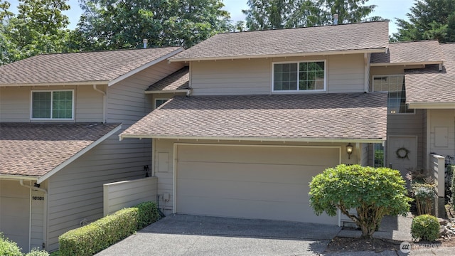 16159 SE 33rd Cir Unit 603, Bellevue, WA 98008 - view of front of property featuring a shingled roof and driveway