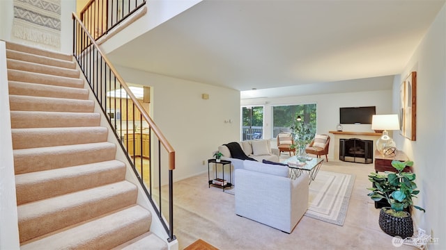 16159 SE 33rd Cir Unit 603, Bellevue, WA 98008 - living room with light carpet, stairway, and a fireplace