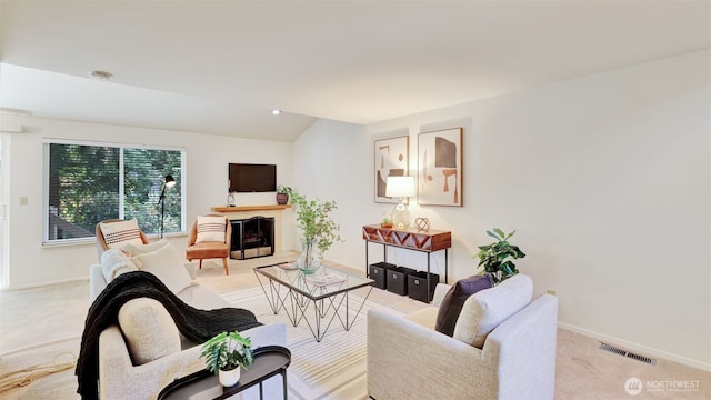 16159 SE 33rd Cir Unit 603, Bellevue, WA 98008 - living area with light colored carpet, a fireplace with raised hearth, and vaulted ceiling