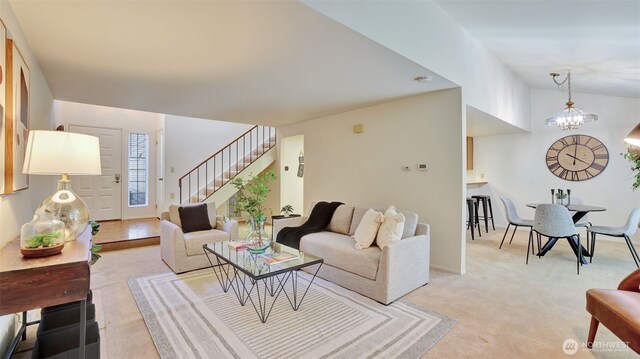 16159 SE 33rd Cir Unit 603, Bellevue, WA 98008 - living room with stairs, a chandelier, and light carpet