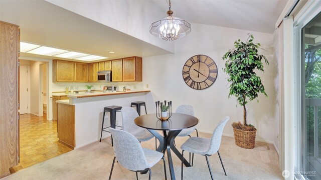 16159 SE 33rd Cir Unit 603, Bellevue, WA 98008 - dining area with a chandelier and lofted ceiling