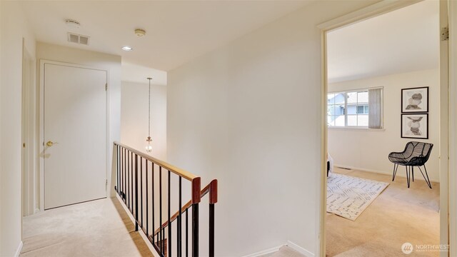 16159 SE 33rd Cir Unit 603, Bellevue, WA 98008 - hallway with an upstairs landing, carpet flooring, and recessed lighting