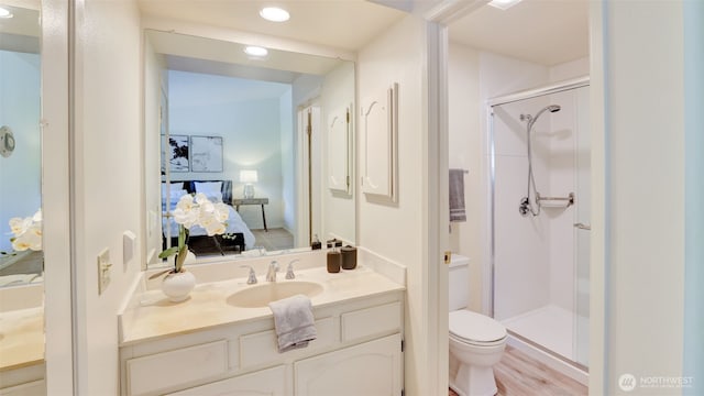 16159 SE 33rd Cir Unit 603, Bellevue, WA 98008 - ensuite bathroom featuring a stall shower, vanity, and recessed lighting