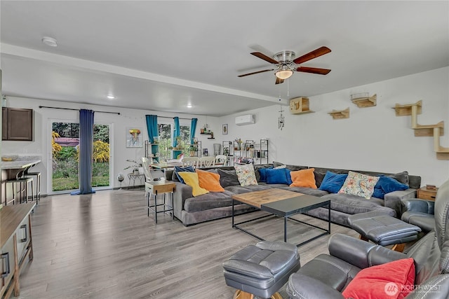 13218 197th St E, Graham, WA 98338 - living room with ceiling fan, light wood finished floors, and a wall mounted AC