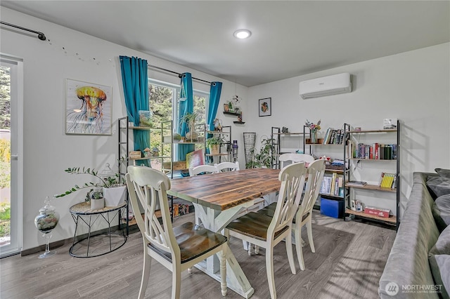 13218 197th St E, Graham, WA 98338 - dining room with an AC wall unit and wood finished floors