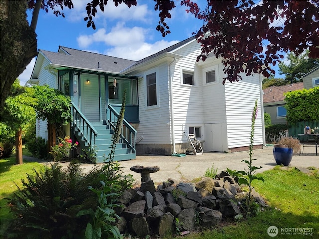 515 N 122nd St, Seattle, WA 98133 - rear view of property featuring stairs and covered porch