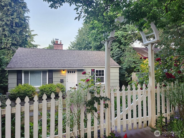 3616 23rd Ave W, Seattle, WA 98199 - view of front of home with roof with shingles and a chimney