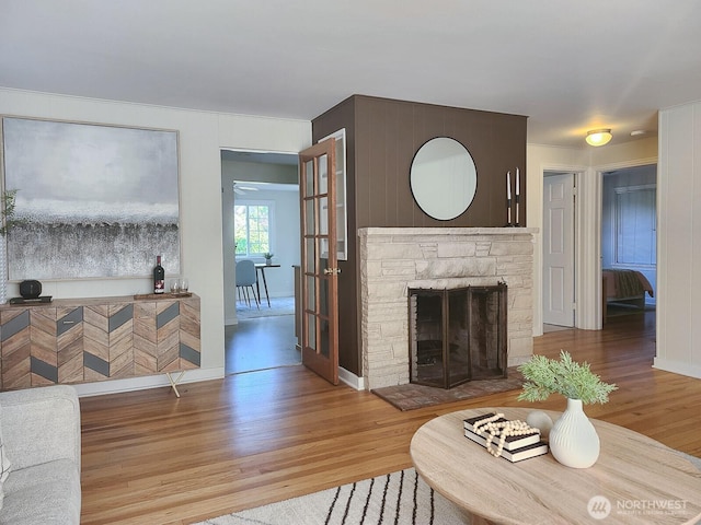 3616 23rd Ave W, Seattle, WA 98199 - living area featuring light wood-style flooring and a fireplace