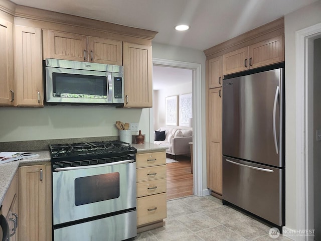 3616 23rd Ave W, Seattle, WA 98199 - kitchen featuring appliances with stainless steel finishes, recessed lighting, light brown cabinets, and light countertops