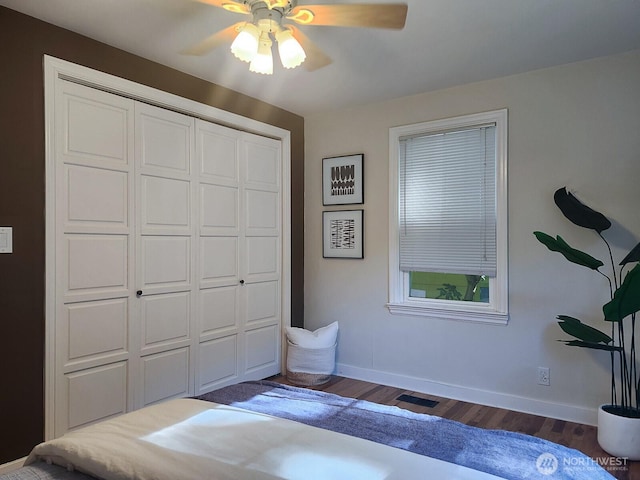 3616 23rd Ave W, Seattle, WA 98199 - bedroom with wood finished floors, a closet, and ceiling fan