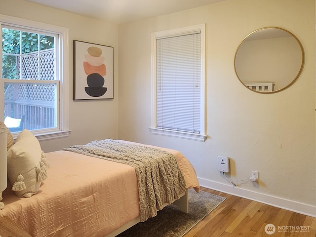 3616 23rd Ave W, Seattle, WA 98199 - bedroom with wood finished floors and multiple windows