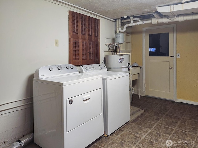 3616 23rd Ave W, Seattle, WA 98199 - laundry room with washer and dryer and a textured ceiling