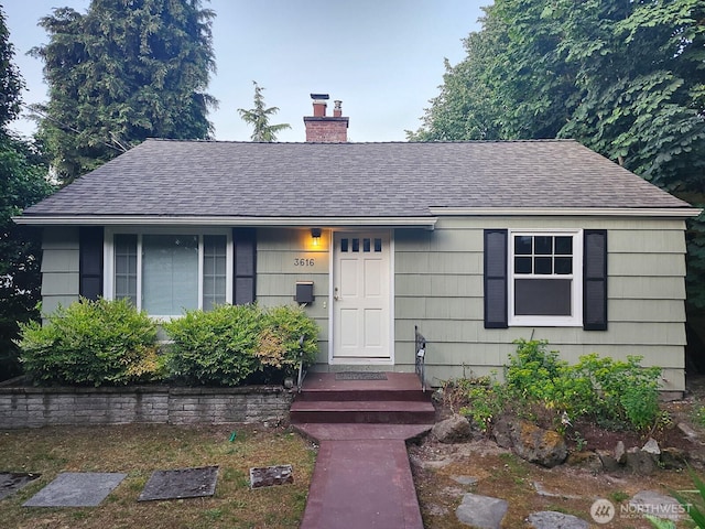 3616 23rd Ave W, Seattle, WA 98199 - single story home featuring a shingled roof and a chimney