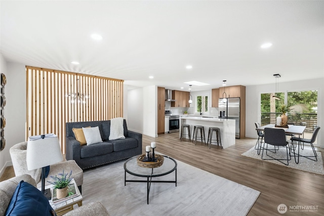 12816 SE 185th Pl, Renton, WA 98058 - living area with recessed lighting, light wood-style floors, and a chandelier