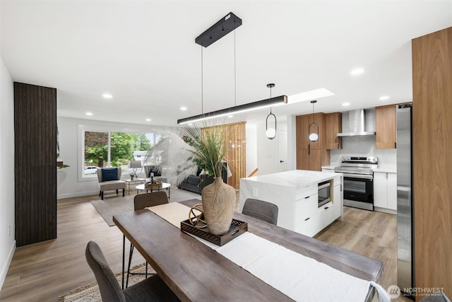 12816 SE 185th Pl, Renton, WA 98058 - dining area featuring recessed lighting and light wood-style flooring