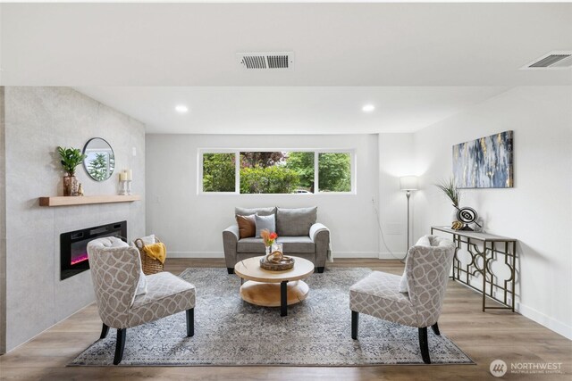 12816 SE 185th Pl, Renton, WA 98058 - living room with a fireplace, wood finished floors, and recessed lighting