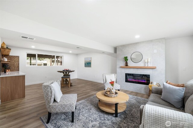 12816 SE 185th Pl, Renton, WA 98058 - living area featuring a fireplace, wood finished floors, and recessed lighting