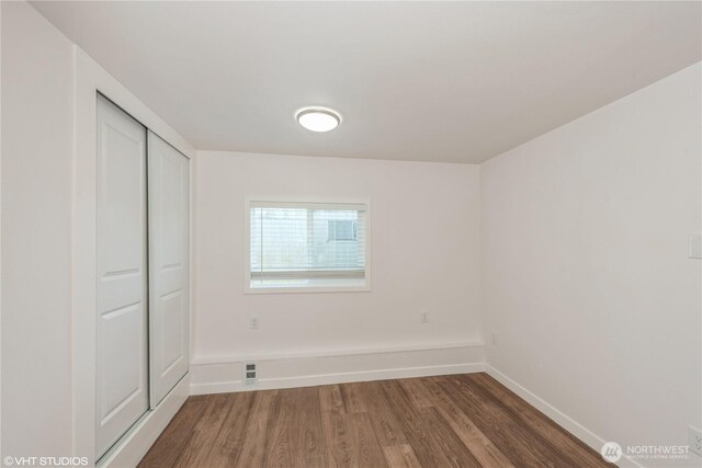 18501 52nd Ave W Unit 31, Lynnwood, WA 98037 - unfurnished bedroom with wood finished floors and a closet