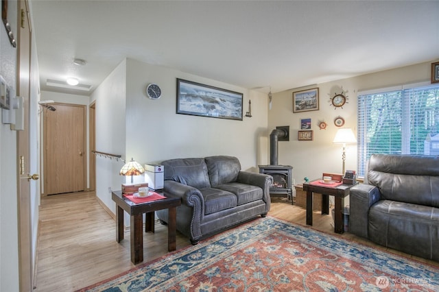 199 Ocean Blvd, Ocean Shores, WA 98569 - living area featuring light wood-style flooring and a wood stove