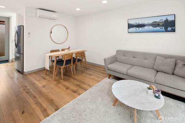 3415D Beacon Ave S, Seattle, WA 98144 - living area featuring an AC wall unit, light wood-style floors, and recessed lighting