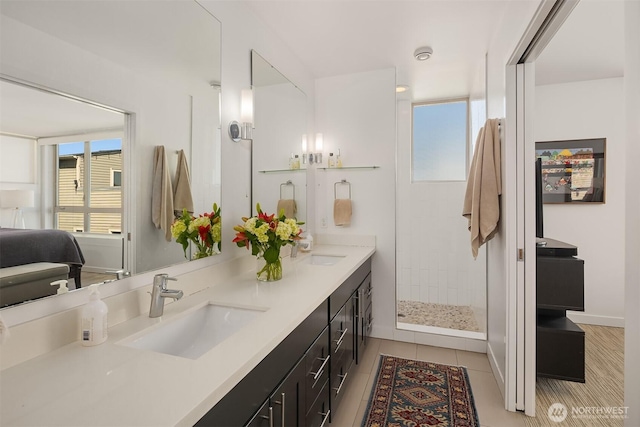 2808 14th Ave W Unit B, Seattle, WA 98119 - bathroom with double vanity, plenty of natural light, walk in shower, and tile patterned flooring