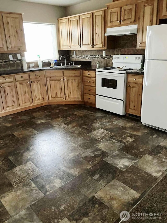 778 Elma Mccleary Rd Unit 20, Mccleary, WA 98557 - kitchen with white appliances, under cabinet range hood, backsplash, and dark countertops